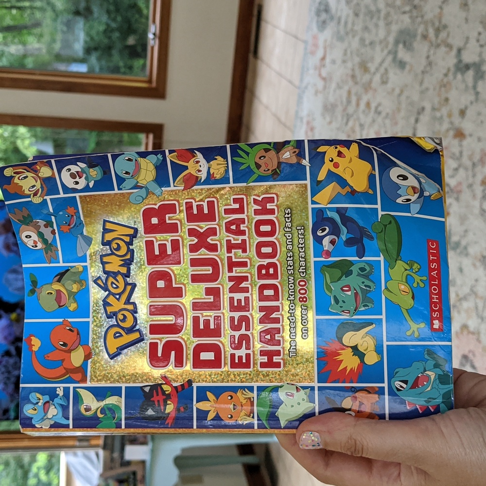 Pokemon book- "Super Deluxe Essential Handbook"